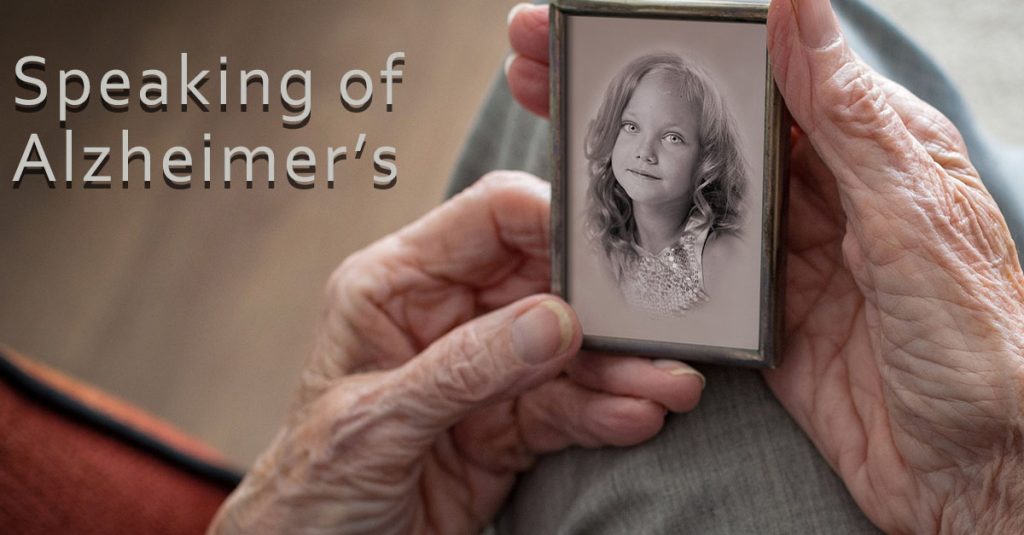 Alzheimer's Communication Tips. A senior person looking at an old photo.